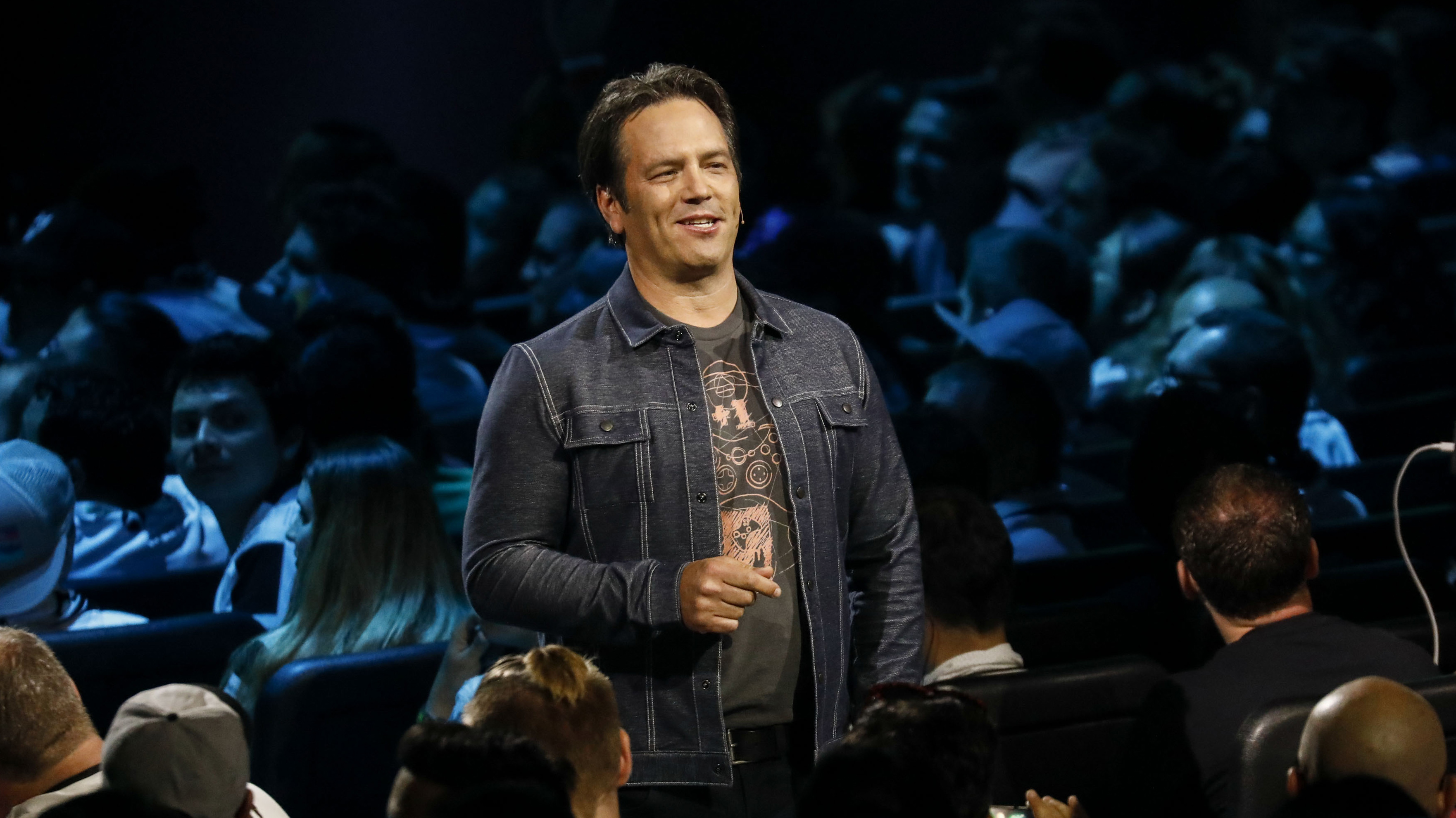 Phil Spencer, executive vice president of Gaming for Microsoft Corp., speaks during the company's Xbox event ahead of the E3 Electronic Entertainment Expo in Los Angeles, California, U.S., in Los Angeles, California, U.S., on Sunday, June 10, 2018. Xbox previewed a flurry of new titles and deals with studios as the video-gaming division of&nbsp;Microsoft&nbsp;looks to compete more intensely with&nbsp;Sony Corp.'s PlayStation and a resurgent Nintendo Co. Photographer: Patrick T. Fallon/Bloomberg via Getty Images